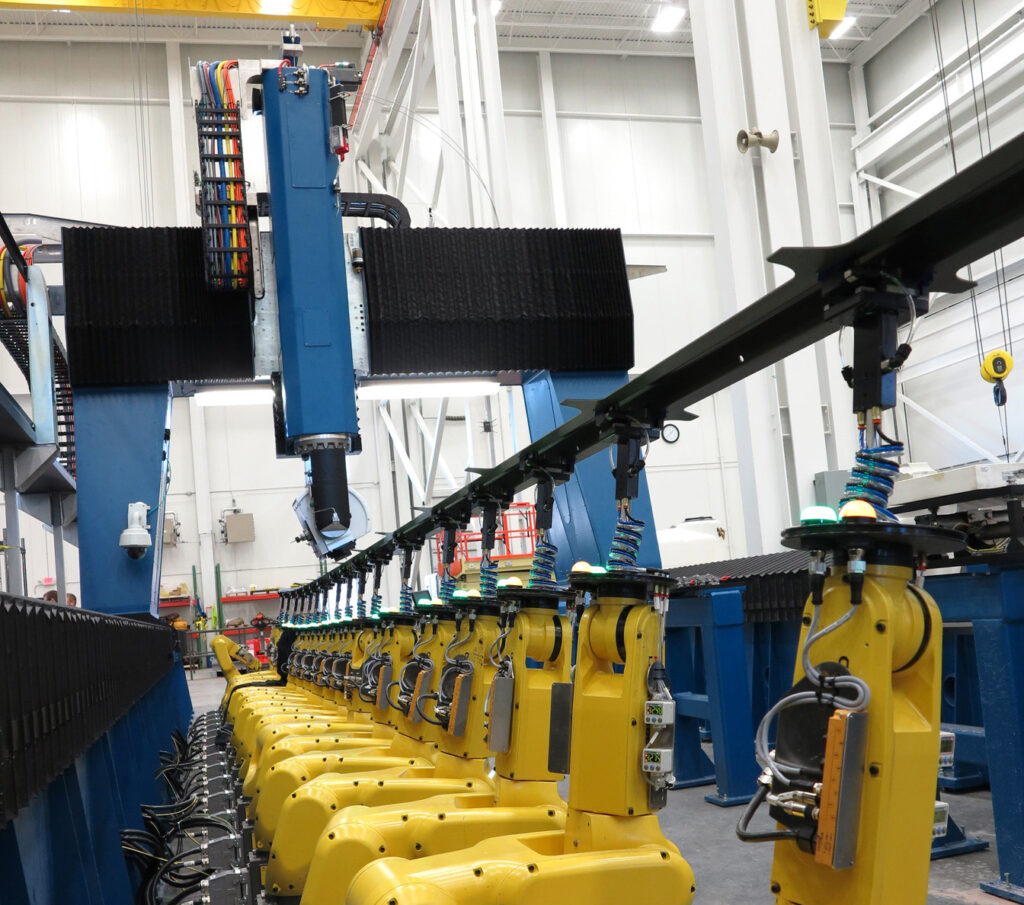 configurable robotic fixture holding composite part