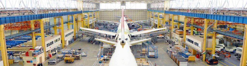 Commercial airplanes being manufactured in a hangar