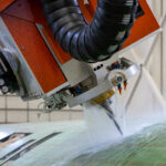 Adaptive waterjet trimming and drilling system for large composite structures