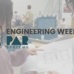 engineering week intro image of two woman reading a blueprint
