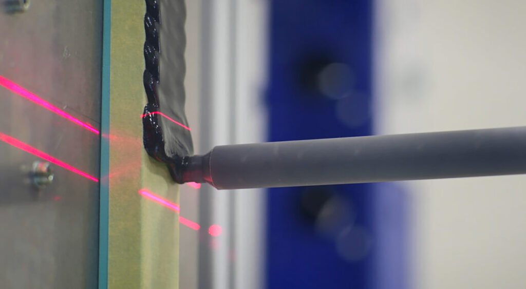 Closeup of a PAR Systems automated adhesive dispensing system.