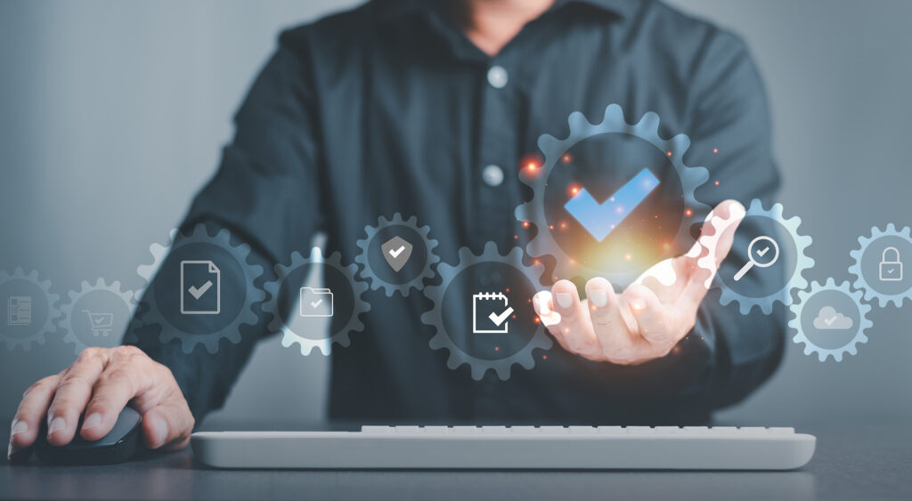 Man behind keyboard with icons floating in front of him