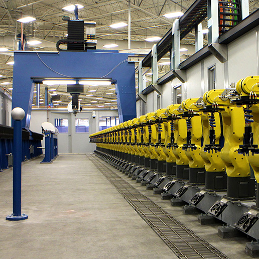 Row of PAR's flexible fixtures in a manufacturing warehouse.