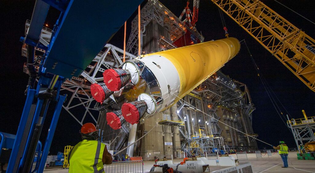 SLS Rocket core stage being lifted by specialty cranes